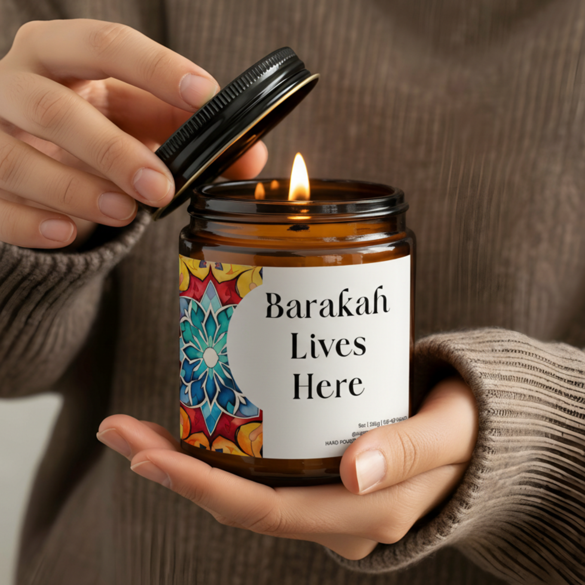 “Barakah Lives Here” Islamic soy candle in amber glass jar on neutral décor tray